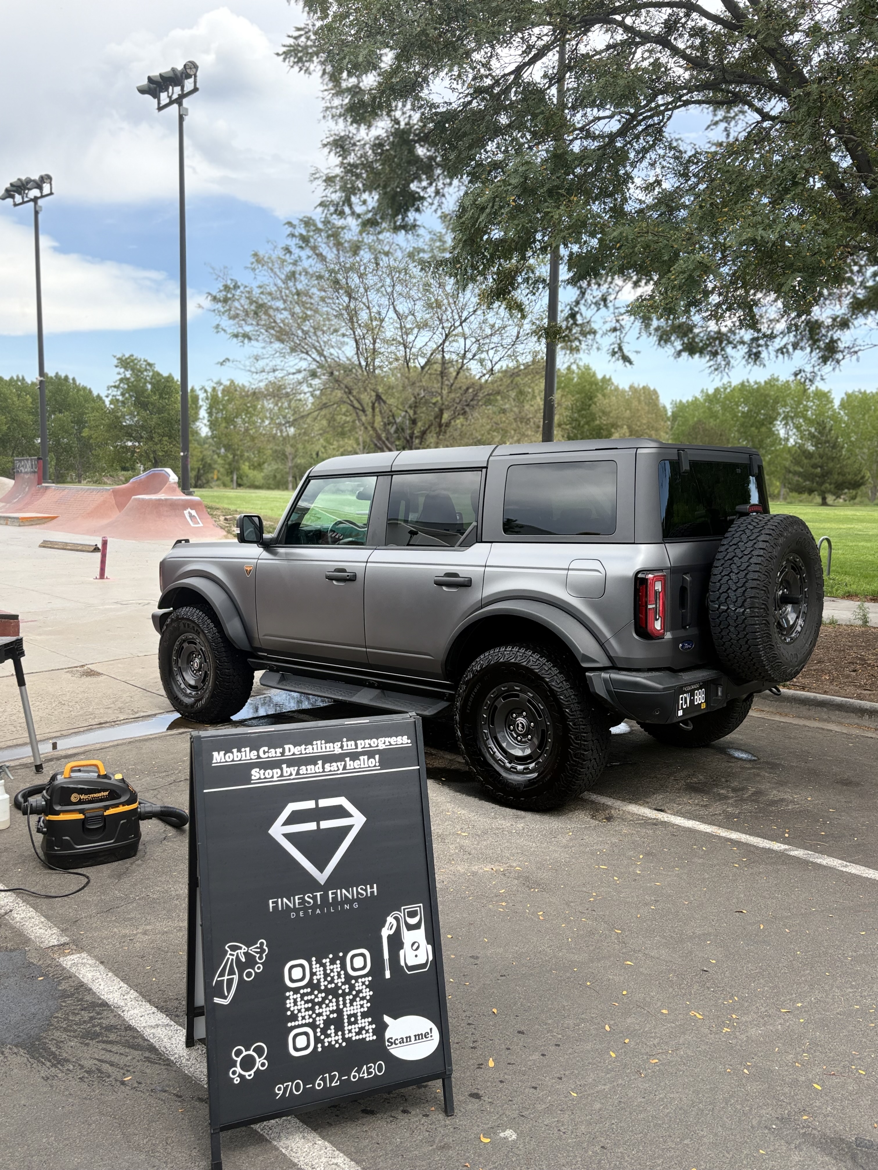Ford Bronco detailed on-site next to the Finest Finish Detailing sign
