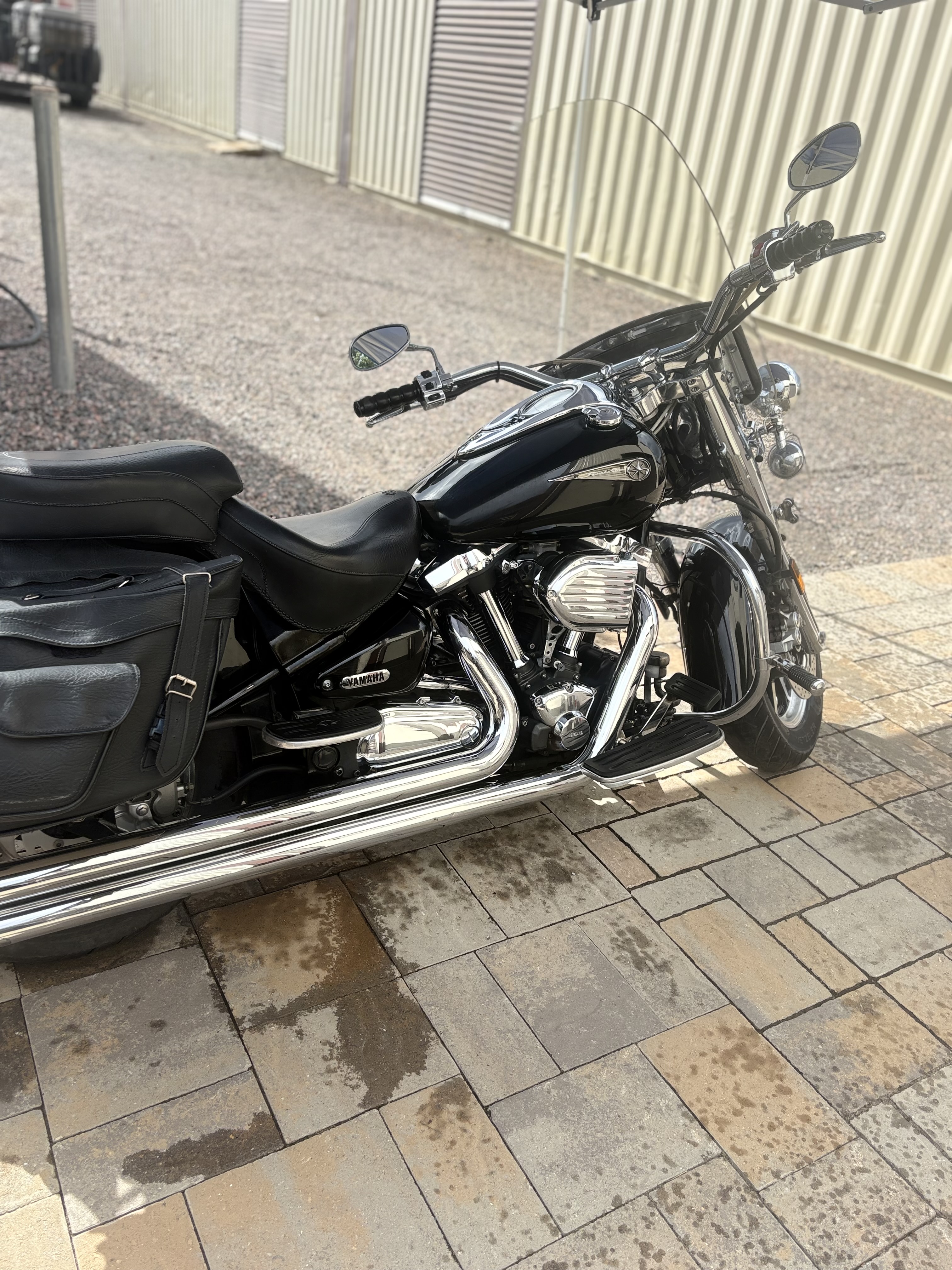 Black Yamaha cruiser motorcycle detailed with polished chrome